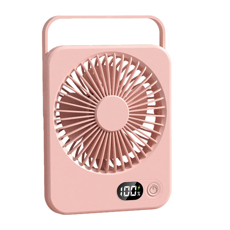 Foldable desk fan on office desk in use